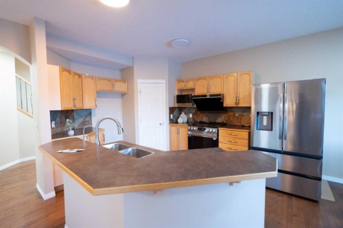 306 Rockyspring Circle Nw, Calgary, AB - Indoor Photo Showing Kitchen With Double Sink