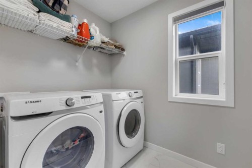 704 Creekstone Circle Sw, Calgary, AB - Indoor Photo Showing Laundry Room