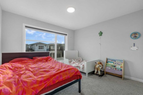 704 Creekstone Circle Sw, Calgary, AB - Indoor Photo Showing Bedroom