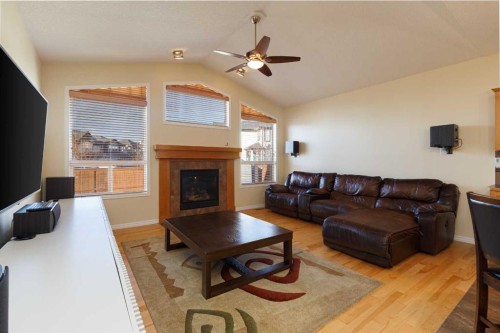 116 Rainbow Falls Grove, Chestermere, AB - Indoor Photo Showing Living Room With Fireplace