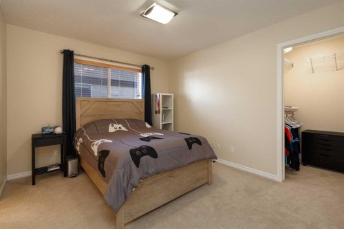 116 Rainbow Falls Grove, Chestermere, AB - Indoor Photo Showing Bedroom