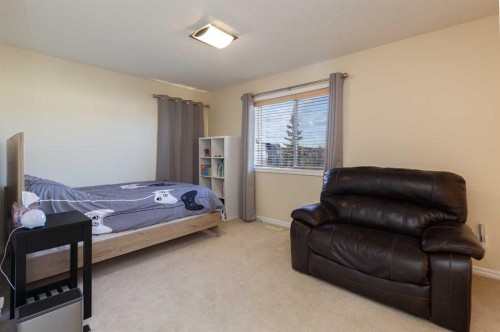 116 Rainbow Falls Grove, Chestermere, AB - Indoor Photo Showing Bedroom