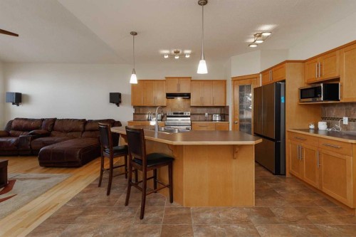 116 Rainbow Falls Grove, Chestermere, AB - Indoor Photo Showing Kitchen With Stainless Steel Kitchen