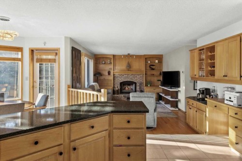 332 Hawkstone Close Nw, Calgary, AB - Indoor Photo Showing Kitchen With Fireplace