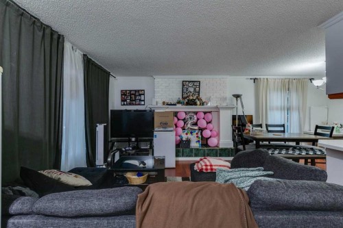 100 Allandale Close Se, Calgary, AB - Indoor Photo Showing Living Room