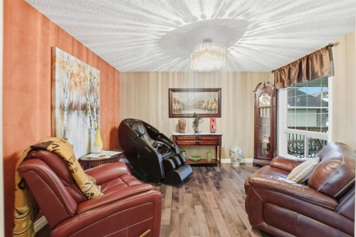 54 Rockbluff Close Nw, Calgary, AB - Indoor Photo Showing Living Room