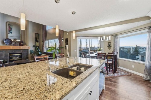 54 Rockbluff Close Nw, Calgary, AB - Indoor Photo Showing Kitchen With Fireplace With Double Sink With Upgraded Kitchen