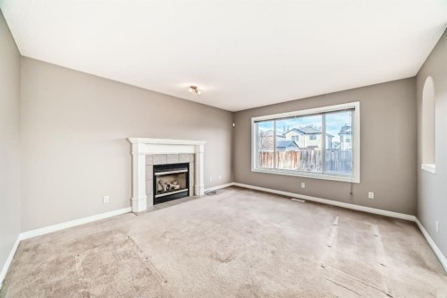 269 Covewood Circle Ne, Calgary, AB - Indoor Photo Showing Living Room With Fireplace