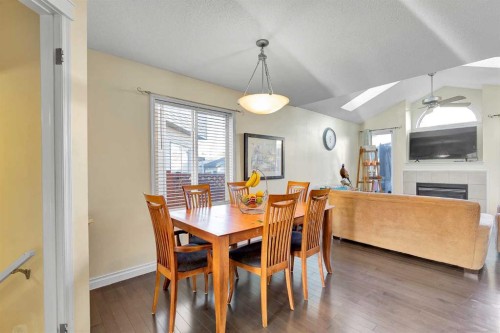 224 Prestwick Avenue Se, Calgary, AB - Indoor Photo Showing Dining Room With Fireplace