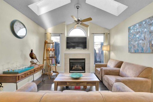 224 Prestwick Avenue Se, Calgary, AB - Indoor Photo Showing Living Room With Fireplace