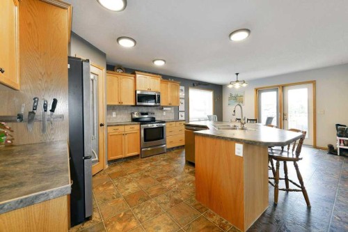509 Country Meadows Street, Diamond Valley, AB - Indoor Photo Showing Kitchen With Double Sink
