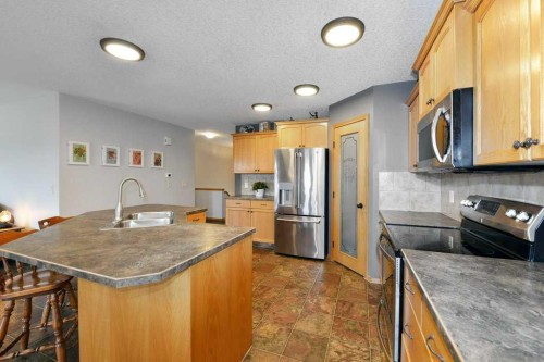 509 Country Meadows Street, Diamond Valley, AB - Indoor Photo Showing Kitchen With Double Sink