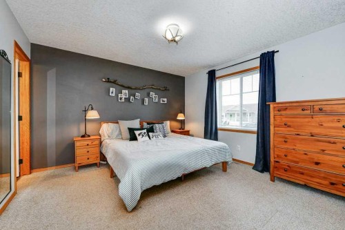 509 Country Meadows Street, Diamond Valley, AB - Indoor Photo Showing Bedroom