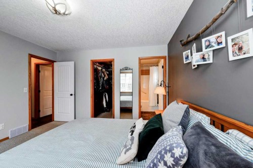 509 Country Meadows Street, Diamond Valley, AB - Indoor Photo Showing Bedroom