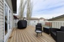 509 Country Meadows Street, Diamond Valley, AB  - Outdoor With Deck Patio Veranda With Exterior 