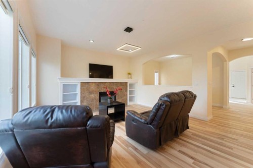 20 Sherwood Circle Nw, Calgary, AB - Indoor Photo Showing Living Room With Fireplace