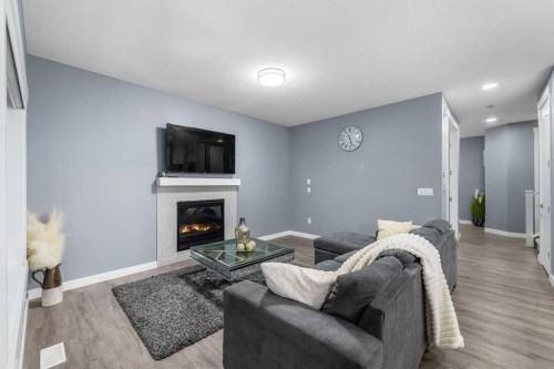 753 Edgefield Crescent, Strathmore, AB - Indoor Photo Showing Living Room With Fireplace