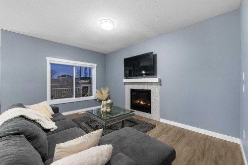 753 Edgefield Crescent, Strathmore, AB - Indoor Photo Showing Living Room With Fireplace