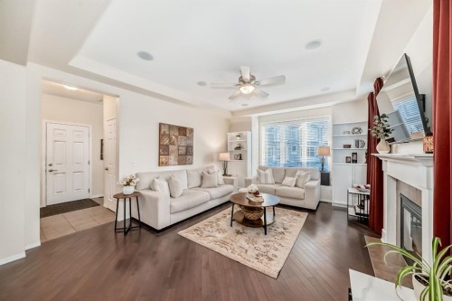912 Windhaven Close Sw, Airdrie, AB - Indoor Photo Showing Living Room With Fireplace