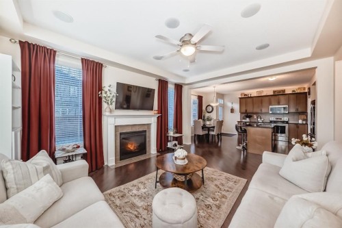912 Windhaven Close Sw, Airdrie, AB - Indoor Photo Showing Living Room With Fireplace