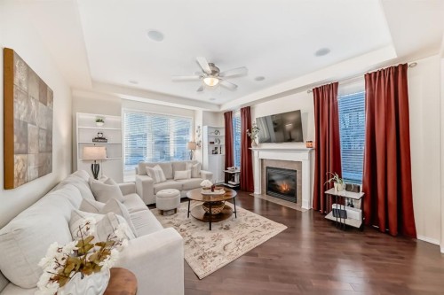 912 Windhaven Close Sw, Airdrie, AB - Indoor Photo Showing Living Room With Fireplace