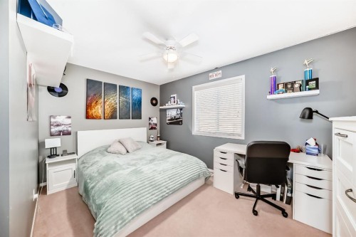 912 Windhaven Close Sw, Airdrie, AB - Indoor Photo Showing Bedroom
