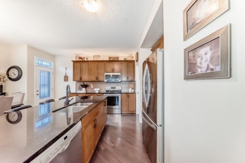912 Windhaven Close Sw, Airdrie, AB - Indoor Photo Showing Kitchen With Double Sink