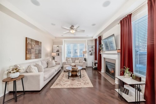 912 Windhaven Close Sw, Airdrie, AB - Indoor Photo Showing Living Room With Fireplace