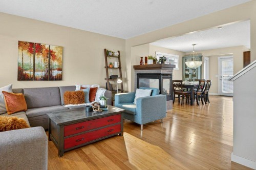18 West Coach Road Sw, Calgary, AB - Indoor Photo Showing Living Room With Fireplace