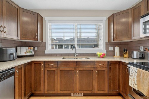 18 West Coach Road Sw, Calgary, AB - Indoor Photo Showing Kitchen With Double Sink