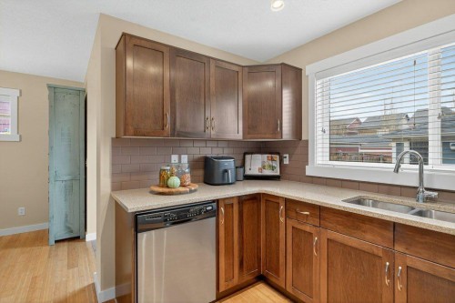 18 West Coach Road Sw, Calgary, AB - Indoor Photo Showing Kitchen With Double Sink