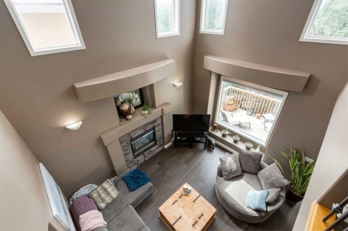 169 Tuscany Ridge Park Nw, Calgary, AB - Indoor Photo Showing Other Room With Fireplace