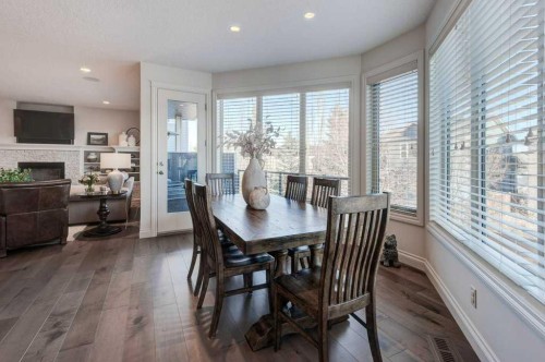 436 Evergreen Circle Sw, Calgary, AB - Indoor Photo Showing Dining Room With Fireplace