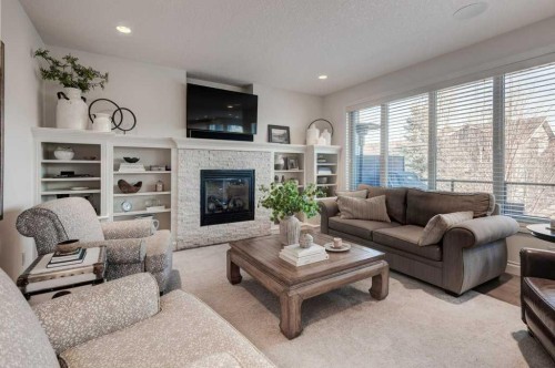 436 Evergreen Circle Sw, Calgary, AB - Indoor Photo Showing Living Room With Fireplace