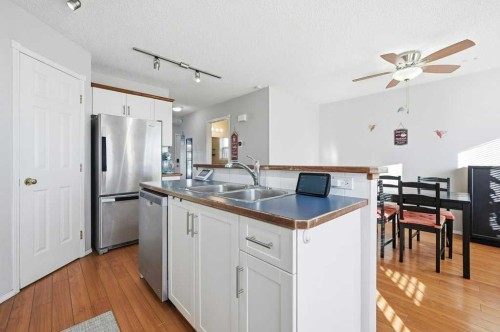 1009 Country Hills Circle Nw, Calgary, AB - Indoor Photo Showing Kitchen With Stainless Steel Kitchen With Double Sink