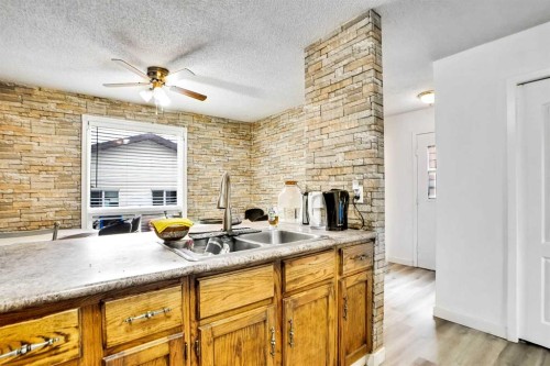 48 Templeridge Crescent Ne, Calgary, AB - Indoor Photo Showing Kitchen With Double Sink
