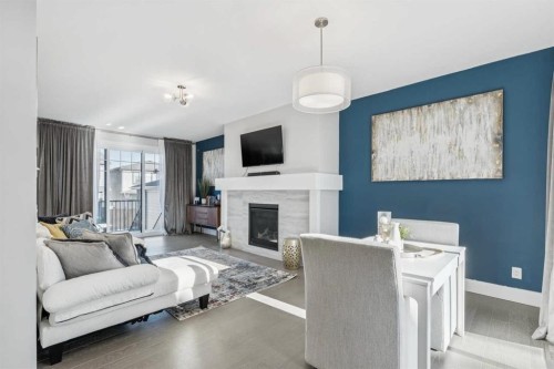 16 Treeline Lane Sw, Calgary, AB - Indoor Photo Showing Living Room With Fireplace