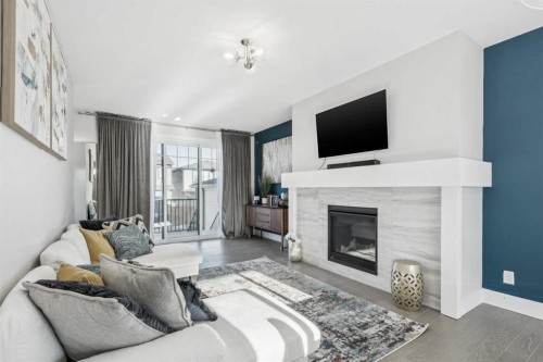 16 Treeline Lane Sw, Calgary, AB - Indoor Photo Showing Living Room With Fireplace