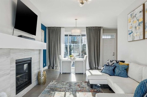 16 Treeline Lane Sw, Calgary, AB - Indoor Photo Showing Living Room With Fireplace