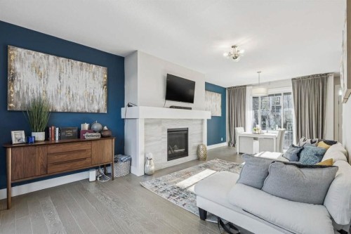 16 Treeline Lane Sw, Calgary, AB - Indoor Photo Showing Living Room With Fireplace