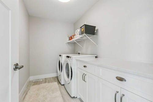 16 Treeline Lane Sw, Calgary, AB - Indoor Photo Showing Laundry Room