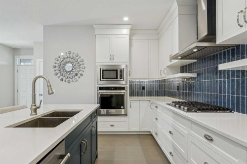 16 Treeline Lane Sw, Calgary, AB - Indoor Photo Showing Kitchen With Double Sink With Upgraded Kitchen