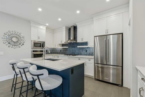 16 Treeline Lane Sw, Calgary, AB - Indoor Photo Showing Kitchen With Stainless Steel Kitchen With Double Sink With Upgraded Kitchen