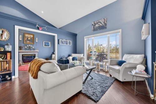 10 Willow Springs Crescent, Sylvan Lake, AB - Indoor Photo Showing Living Room With Fireplace