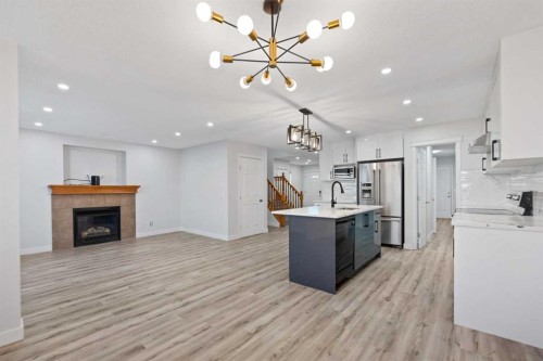 154 Taralake Way Ne, Calgary, AB - Indoor Photo Showing Kitchen With Fireplace
