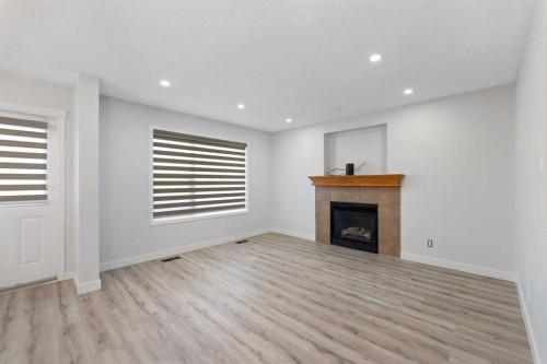 154 Taralake Way Ne, Calgary, AB - Indoor Photo Showing Living Room With Fireplace