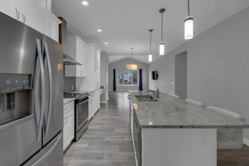 137 Willow Park North, Cochrane, AB - Indoor Photo Showing Kitchen With Stainless Steel Kitchen With Double Sink With Upgraded Kitchen