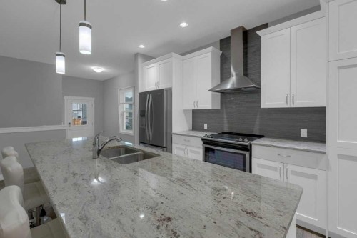 137 Willow Park North, Cochrane, AB - Indoor Photo Showing Kitchen With Stainless Steel Kitchen With Double Sink With Upgraded Kitchen