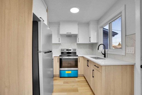 7842 21A Street Se, Calgary, AB - Indoor Photo Showing Kitchen With Stainless Steel Kitchen With Double Sink