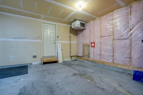15 Tuscany Reserve Bay Nw, Calgary, AB - Indoor Photo Showing Garage